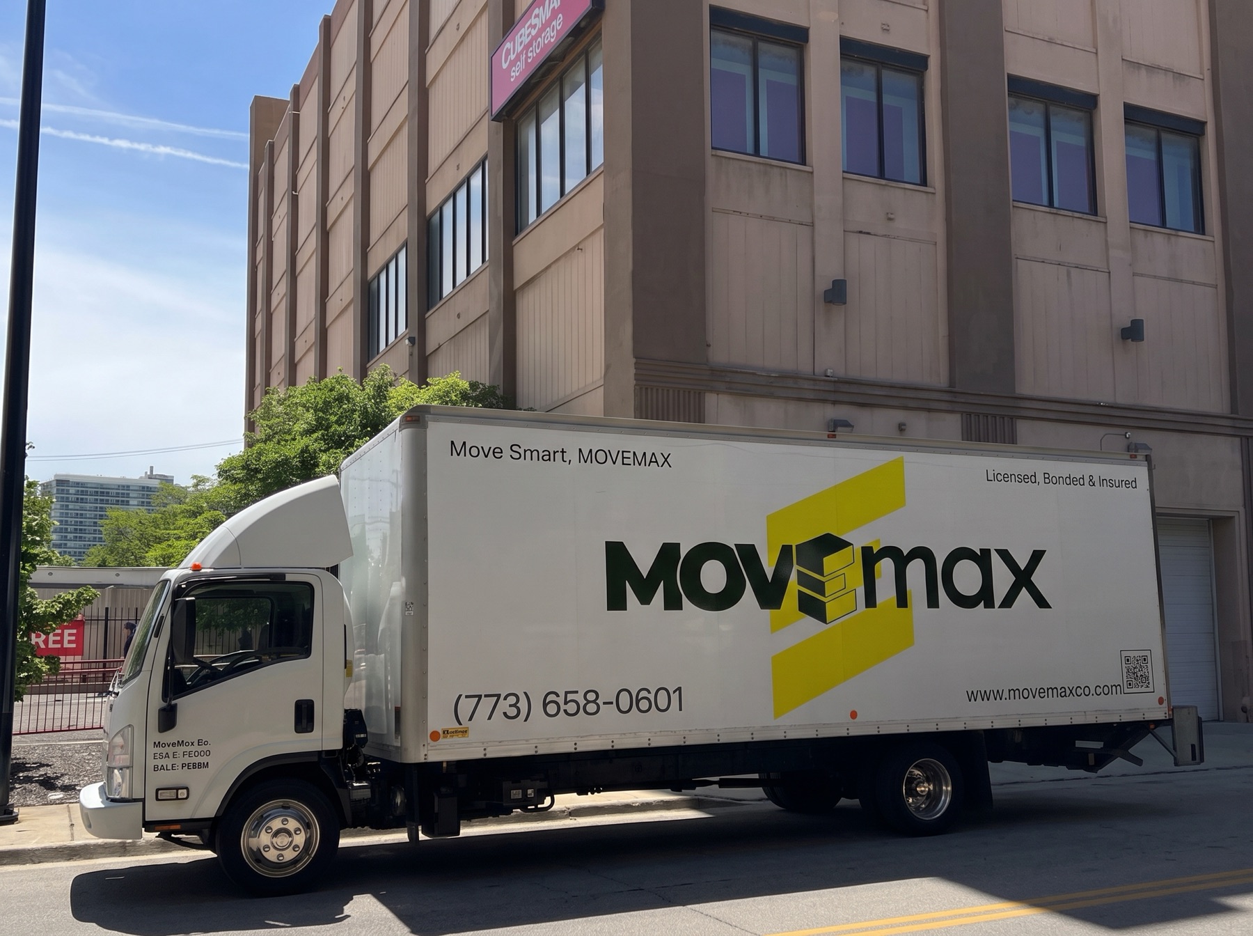 The MoveMax truck parked on a Chicago street